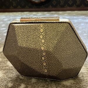 Herve Leger gold clutch